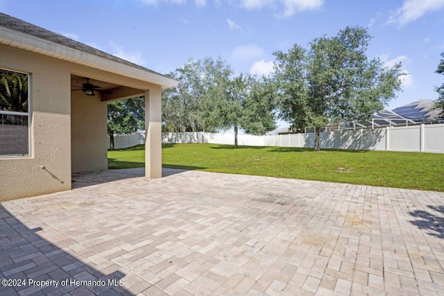 view of patio featuring ceiling fan