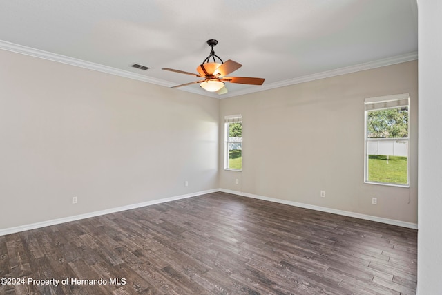 spare room with dark hardwood / wood-style floors, ceiling fan, and crown molding