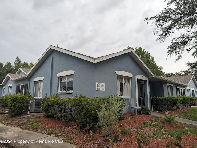 view of front of house with central air condition unit