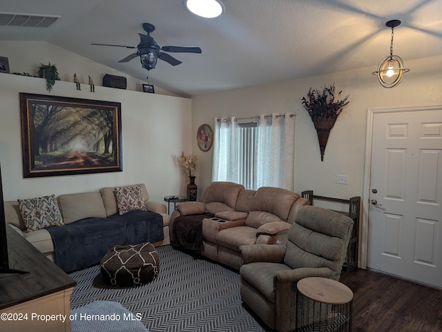 living room featuring ceiling fan, lofted ceiling, and dark hardwood / wood-style floors