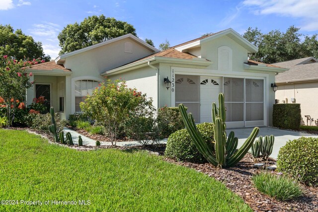 ranch-style home with a front lawn