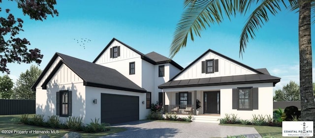 modern farmhouse with a garage and a porch