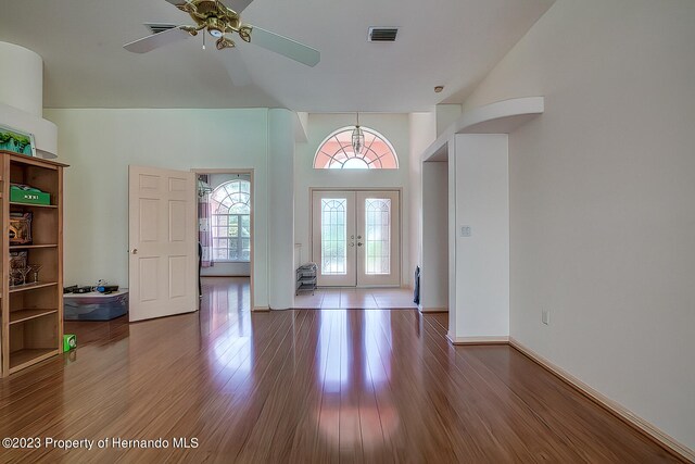 foyer entrance featuring french doors, hardwood / wood-style flooring, and ceiling fan