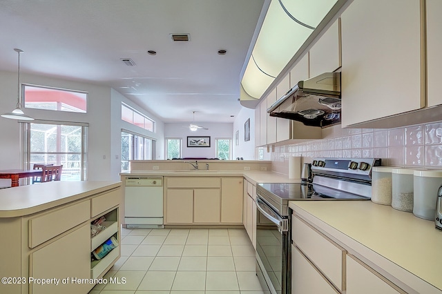 kitchen featuring extractor fan, white dishwasher, stainless steel electric stove, pendant lighting, and decorative backsplash