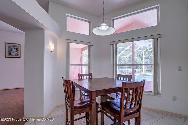 dining area with light tile patterned flooring