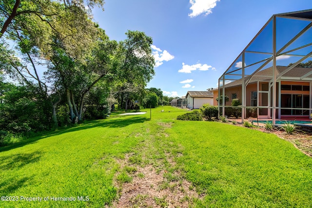 view of yard with a lanai