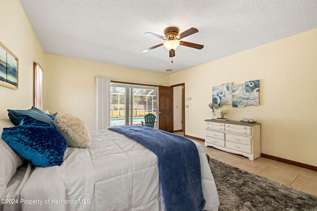 tiled bedroom featuring a textured ceiling, ceiling fan, and access to exterior