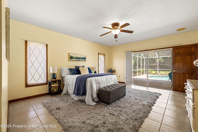 tiled bedroom with a textured ceiling, access to outside, and ceiling fan