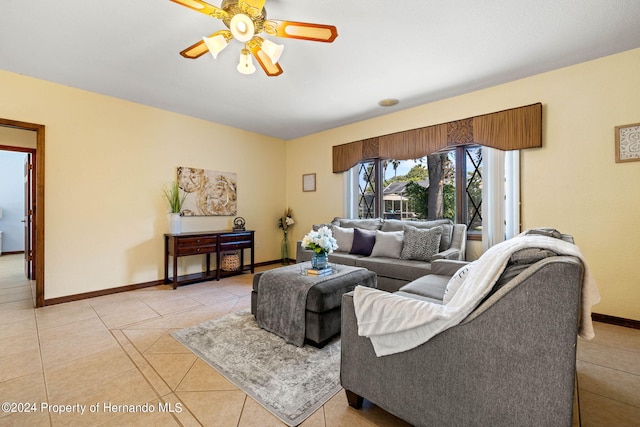 living room featuring ceiling fan and light tile patterned flooring