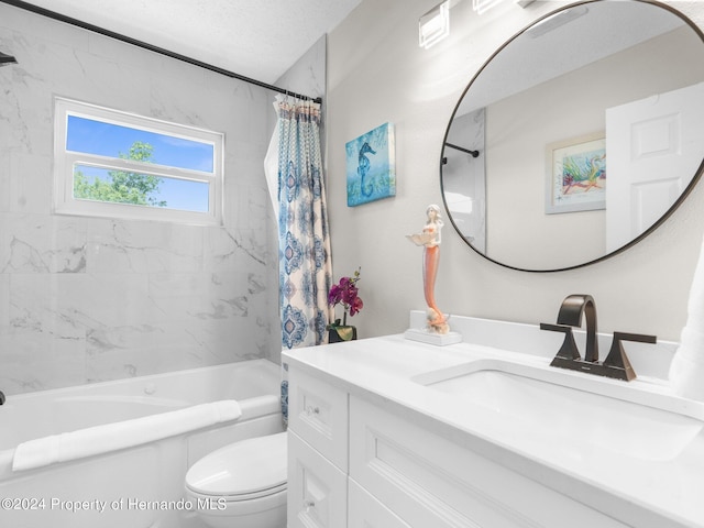 full bathroom featuring a textured ceiling, vanity, toilet, and shower / bath combo with shower curtain