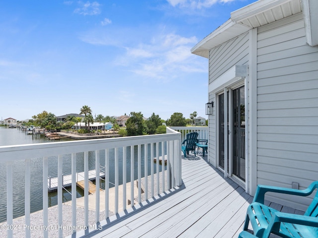 wooden deck featuring a water view