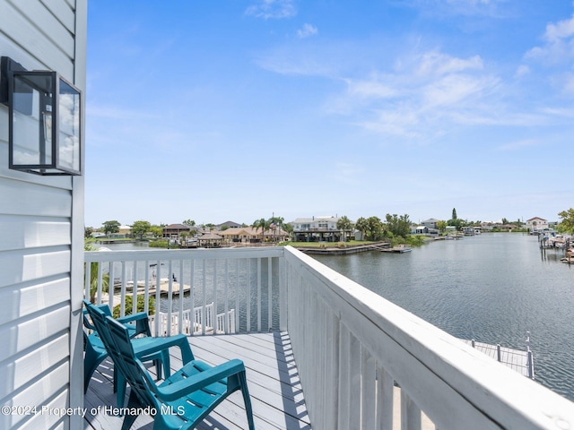 balcony featuring a water view