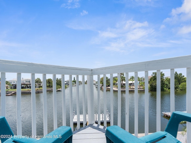 exterior space featuring a water view and a dock