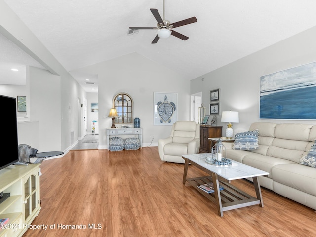 living room with light hardwood / wood-style floors, ceiling fan, and lofted ceiling