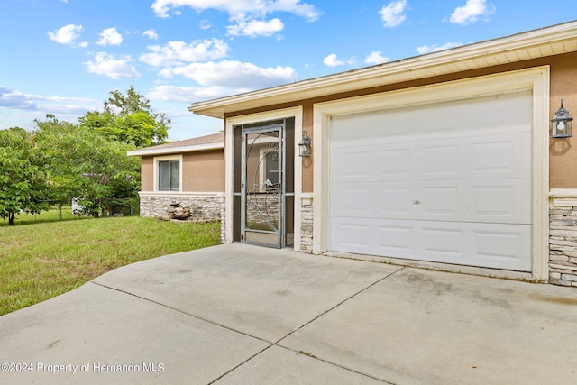 garage with a lawn