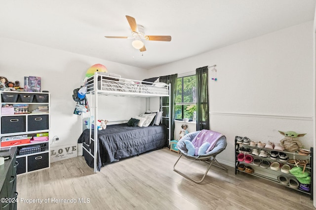 bedroom featuring hardwood / wood-style flooring and ceiling fan