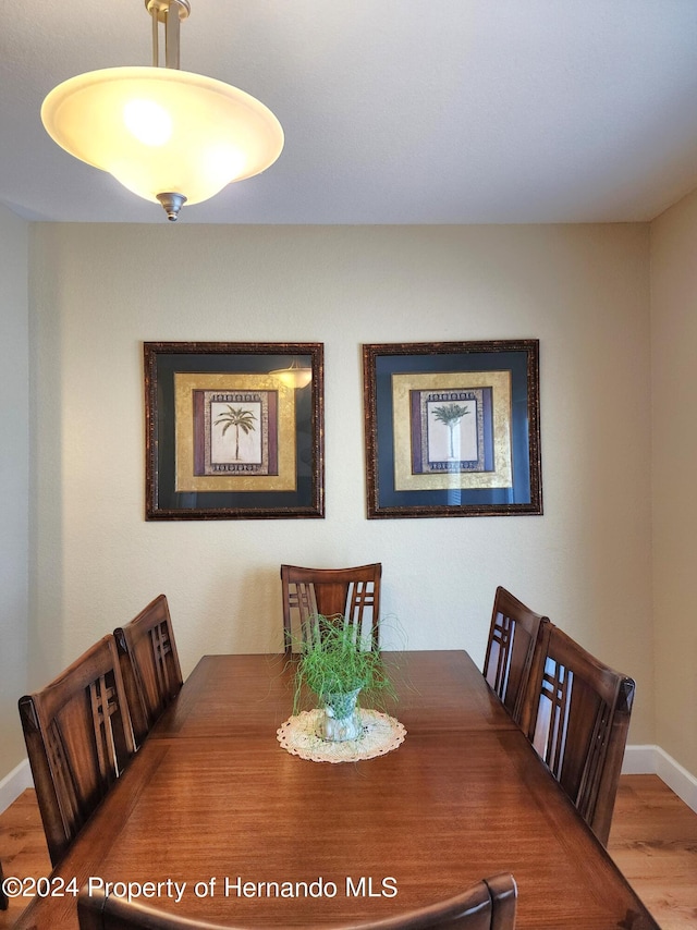 dining area with hardwood / wood-style floors