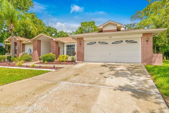 ranch-style house featuring a garage