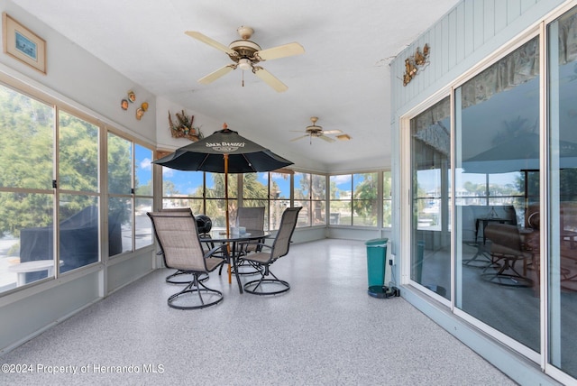 sunroom with a healthy amount of sunlight and ceiling fan