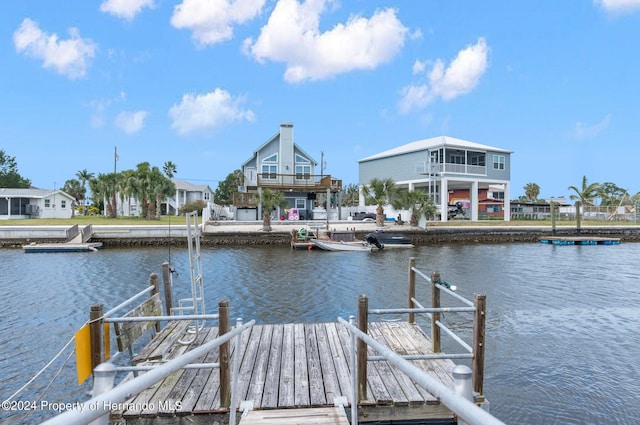 dock area with a water view