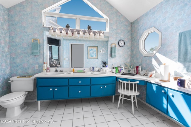 bathroom with tile patterned flooring, vanity, and toilet