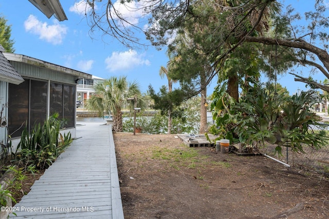 view of yard featuring a sunroom