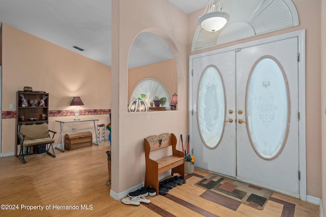 foyer with french doors and light wood-type flooring