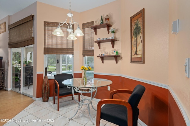 dining room with a chandelier and light hardwood / wood-style floors