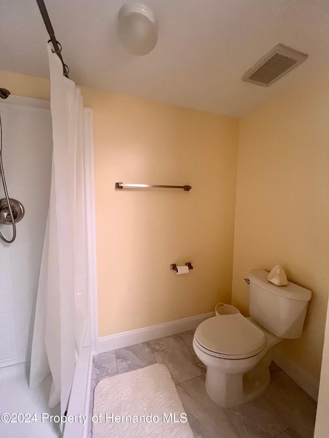 bathroom featuring toilet