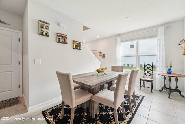 dining area with light tile patterned floors