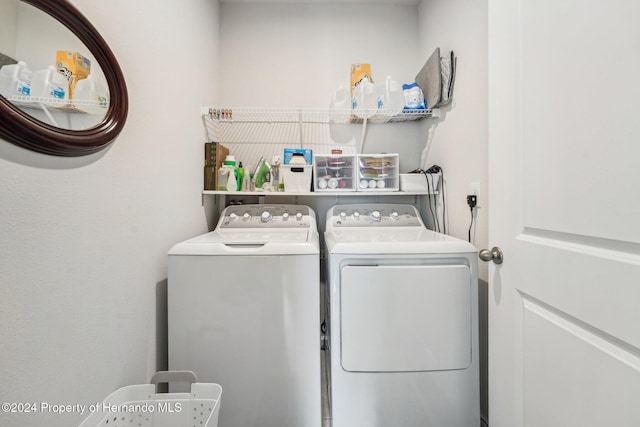 washroom featuring washing machine and dryer