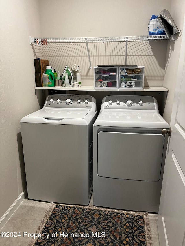 laundry area with washing machine and clothes dryer