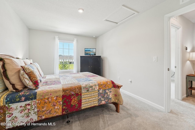 bedroom with light carpet