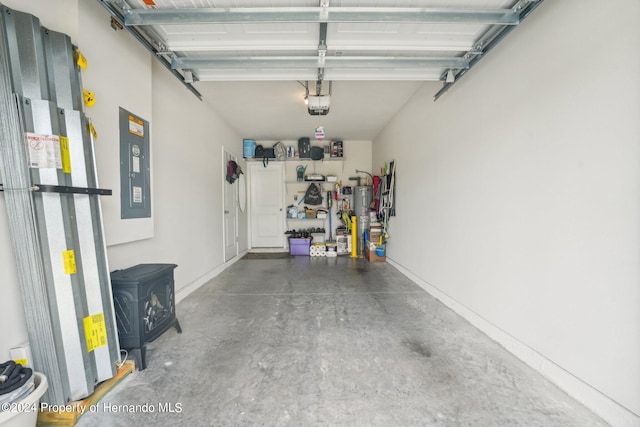 garage featuring a garage door opener and electric panel