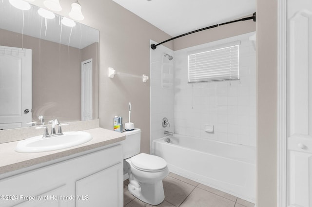 full bathroom with tile patterned floors, tiled shower / bath combo, toilet, and vanity