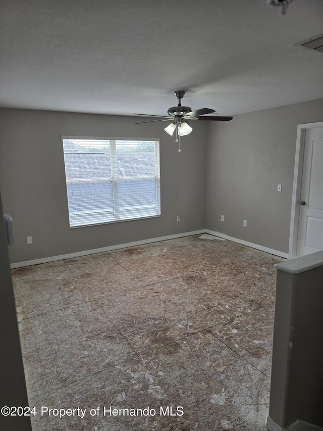 unfurnished room featuring ceiling fan