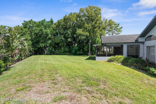 view of yard with a sunroom