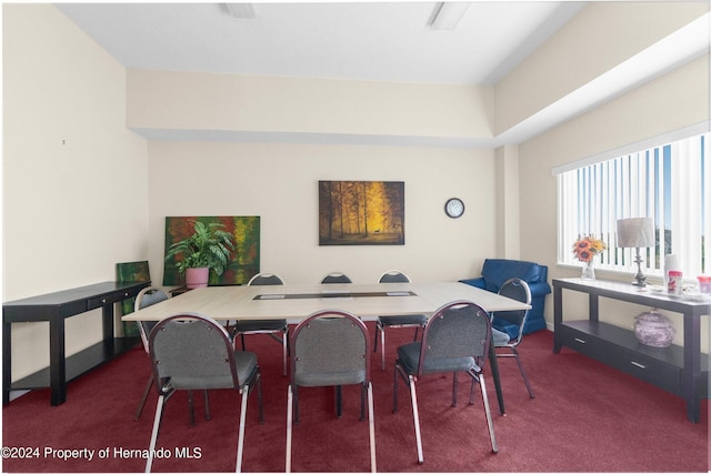 view of carpeted dining area