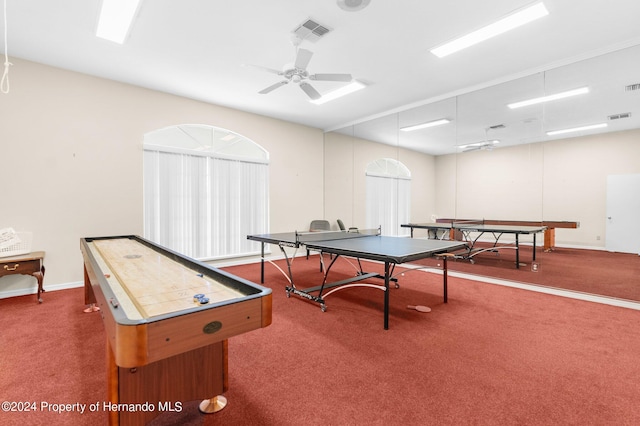 recreation room featuring ceiling fan and dark carpet