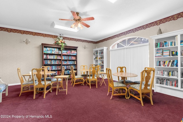 dining area with ceiling fan, carpet flooring, and ornamental molding