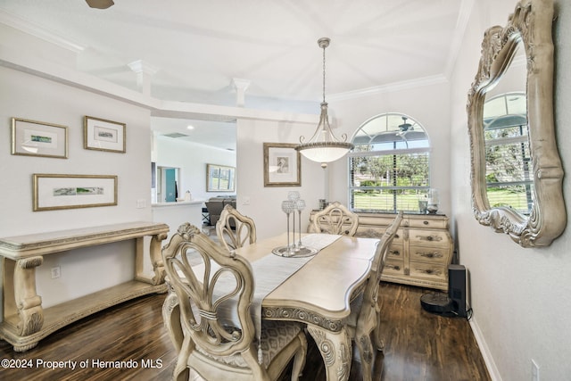 dining space featuring dark hardwood / wood-style floors and crown molding