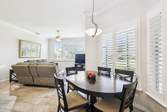 dining room featuring ceiling fan and crown molding