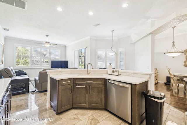 kitchen featuring dishwasher, hanging light fixtures, sink, and crown molding