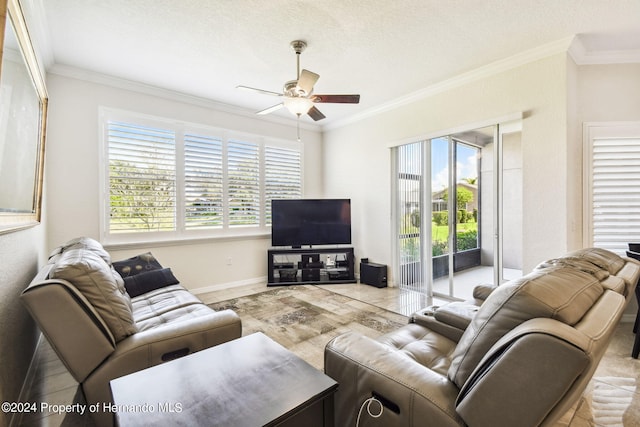 living room with ornamental molding, a textured ceiling, a healthy amount of sunlight, and ceiling fan