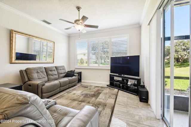 living room with a textured ceiling, ceiling fan, and crown molding