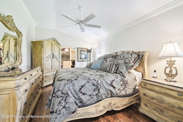 bedroom featuring dark wood-type flooring, ceiling fan, crown molding, and lofted ceiling