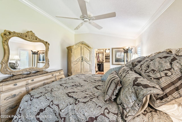 bedroom featuring crown molding, lofted ceiling, multiple windows, and ceiling fan