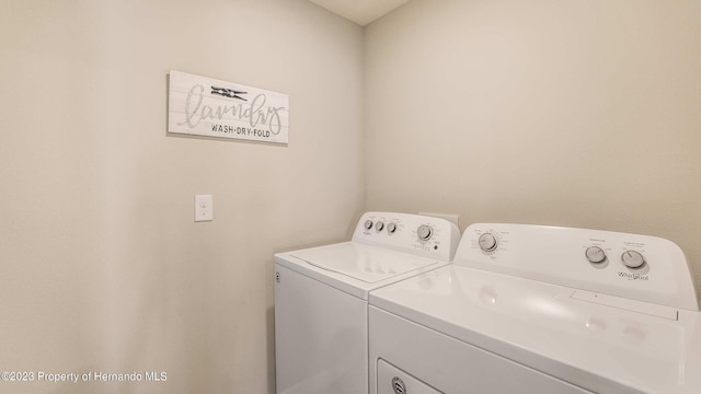 washroom featuring independent washer and dryer