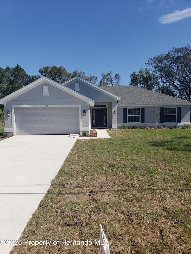 ranch-style house with a garage, a shingled roof, driveway, stucco siding, and a front yard