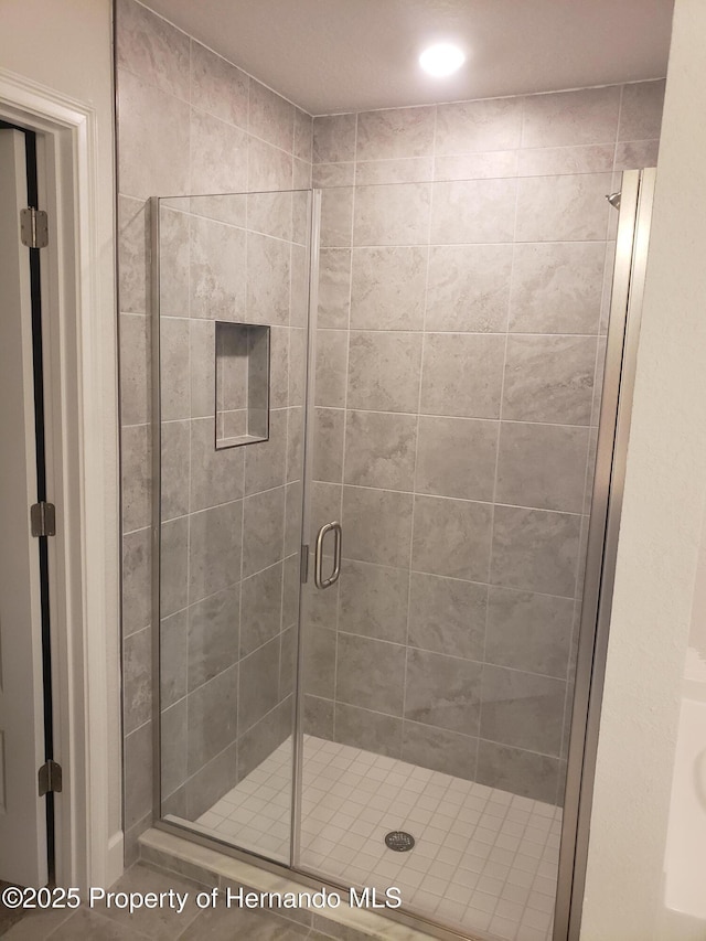 bathroom with a stall shower